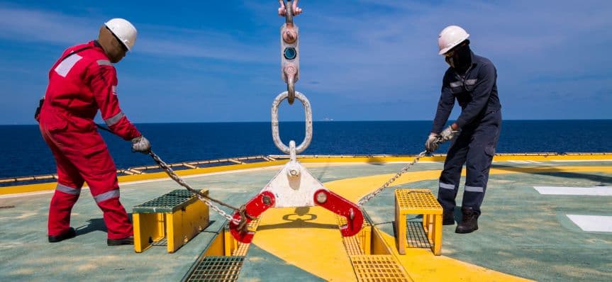 Two riggers working on deck